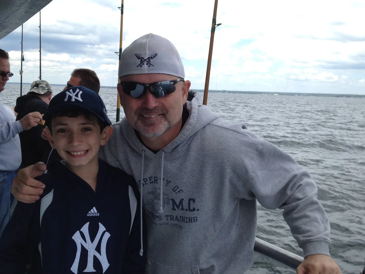 Bryan Collins aboard a party boat with his son